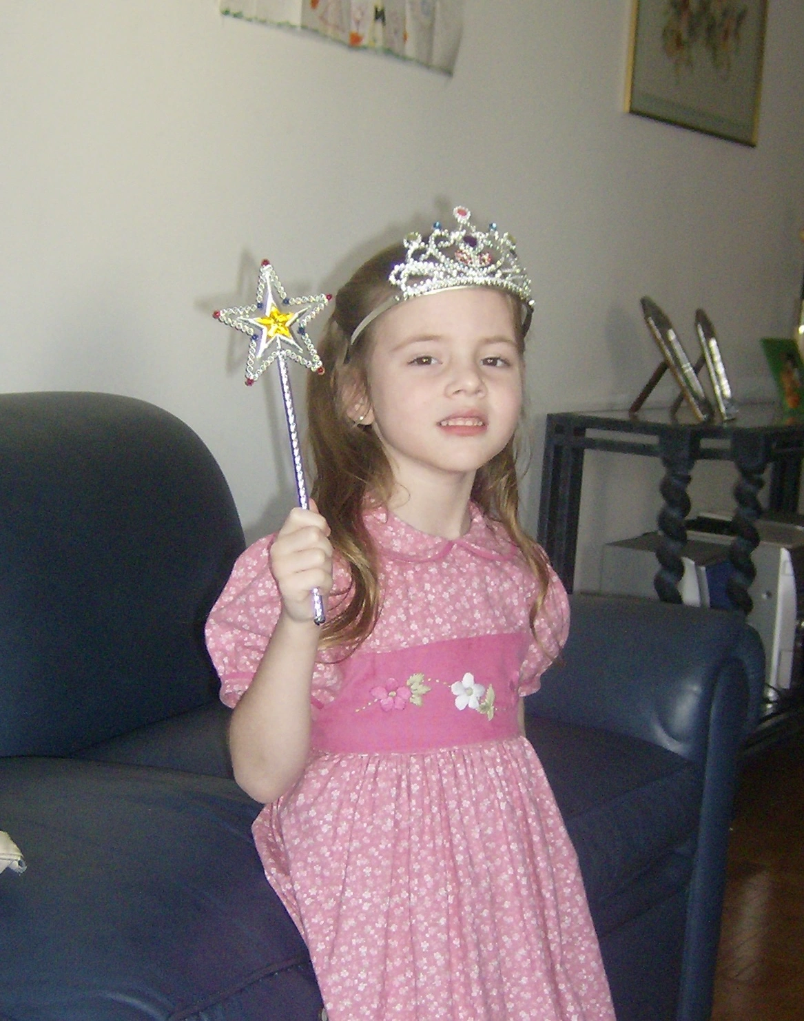 Young Caro with a crown and wand, already dressing the part